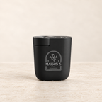 Black Maison Scents Mini Home Fragrance Diffuser Plug-In on a clean ivory background