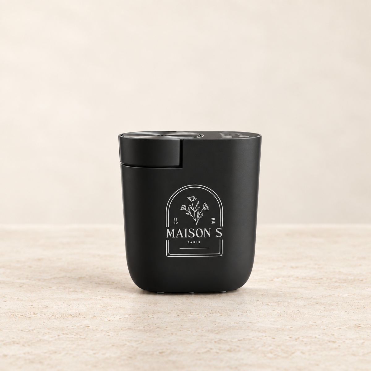 Black Maison Scents Mini Home Fragrance Diffuser Plug-In on a clean ivory background