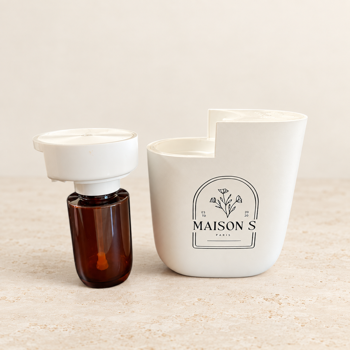 Maison Scents Mini Home Plug-In diffuser opened with fragrance reservoir